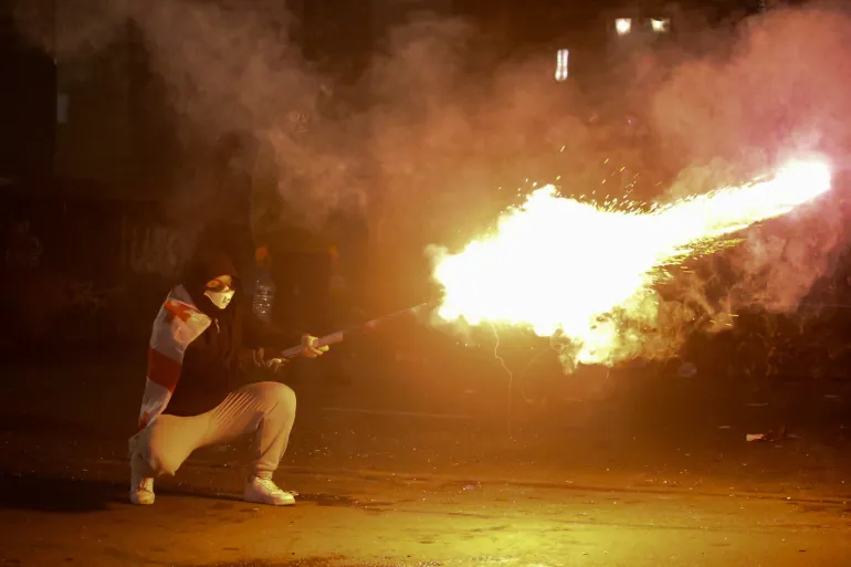 Police raid Georgia opposition parties’ offices as protests continue