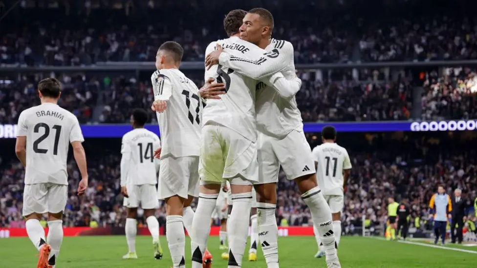 Real Madrid beat Sevilla to keep pressure on leaders Atletico