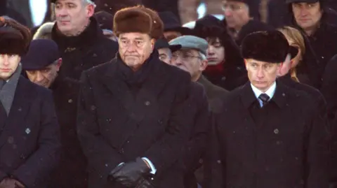 Getty Images Vladimir Putin (pictured next to former French president Jacques Chirac) attended the 2005 ceremony in Poland commemorating the 60th anniversary of the liberation of Auschwitz