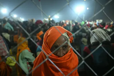 AFP A devotee stands at the site of stampede amid the ongoing Maha Kumbh Mela festival in Prayagraj on January 29, 2025.