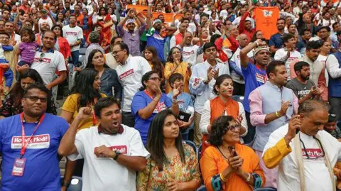 Getty Images Supporters of India's prime minister, Narendra Modi cheer during the Howdy Modi event at NRG Stadium day, Sept. 22, 2019, in Houston.