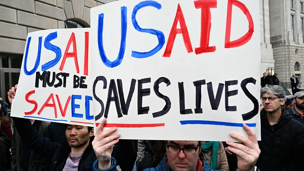Turmoil as Trump and Musk take aim at top US aid agency
